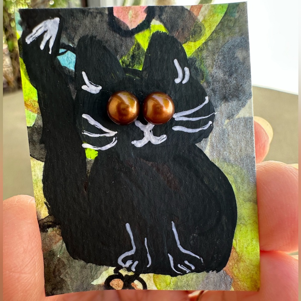 One of a kind, handmade artwork black cat with rust colored stud earring eyes